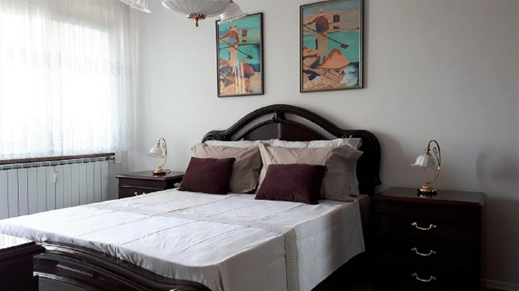 מיטה או מיטות בחדר ב-Apartma Lilu