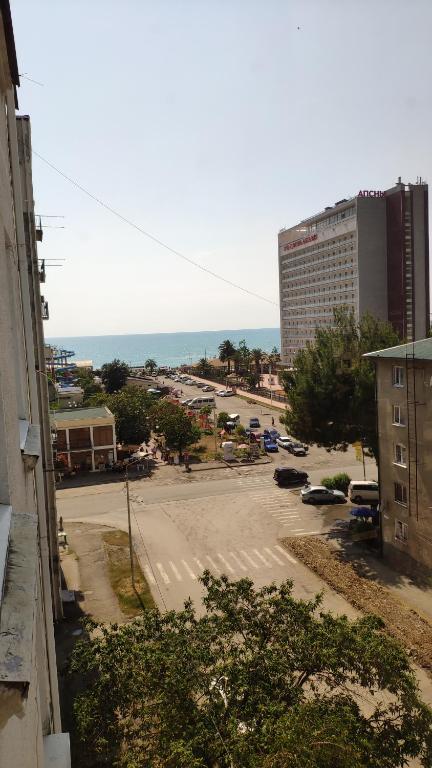 a view of a parking lot in a city at улица Абазгаа Апартаменты in Gagra