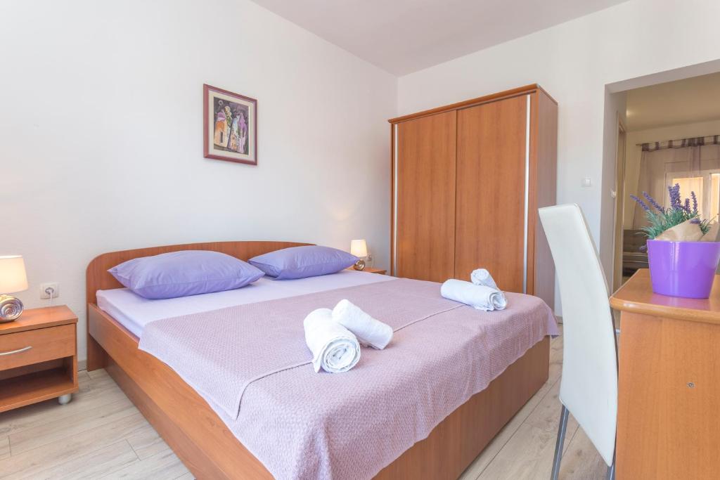 Posteľ alebo postele v izbe v ubytovaní Apartment Božo