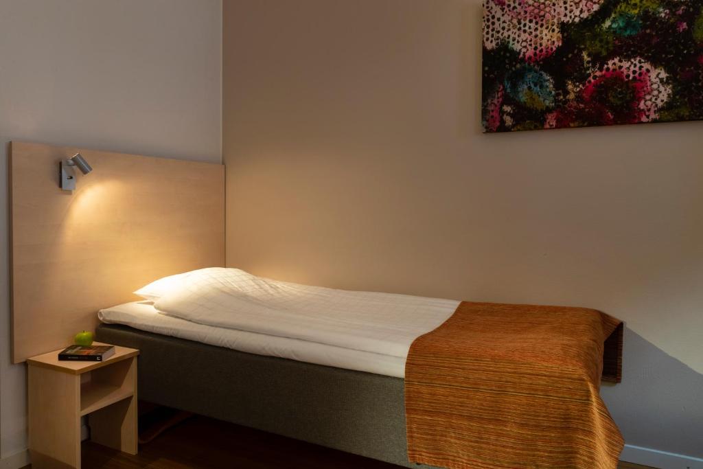 Postel nebo postele na pokoji v ubytování Hotell Vilja