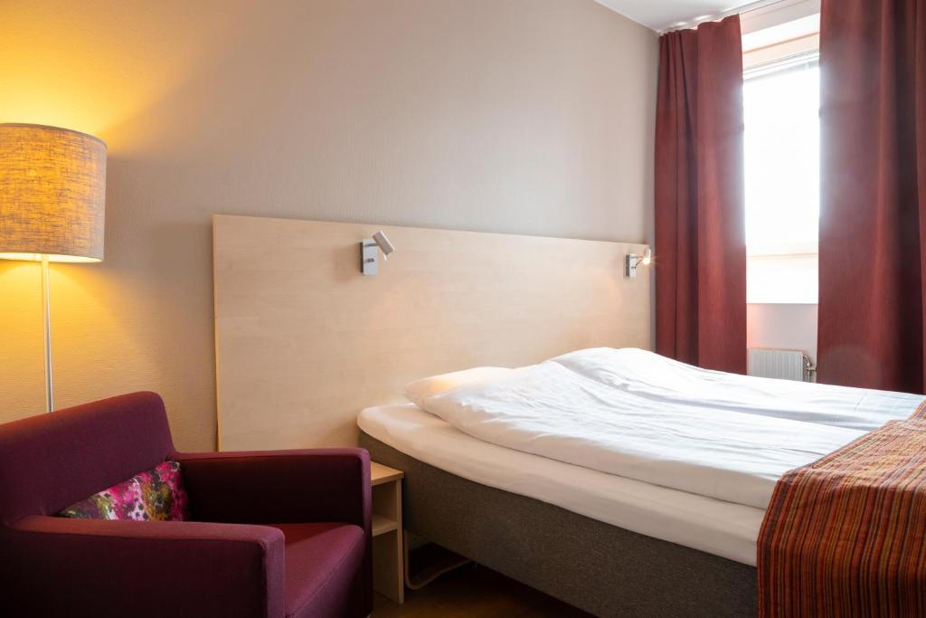 Postel nebo postele na pokoji v ubytování Hotell Vilja