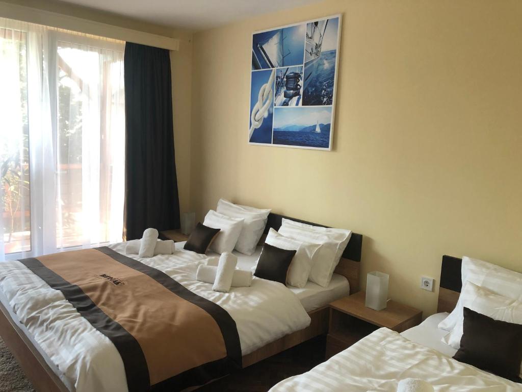 Posteľ alebo postele v izbe v ubytovaní Bier-Lak Apartman House 71