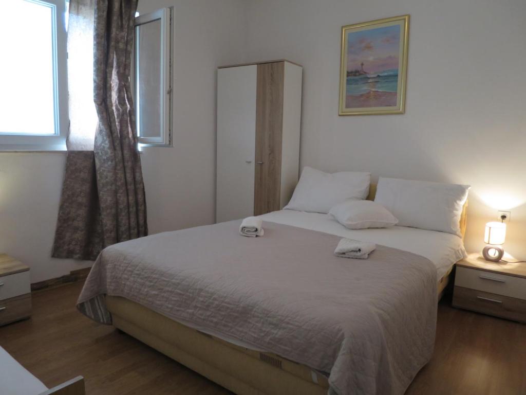 Posteľ alebo postele v izbe v ubytovaní Apartments Milica
