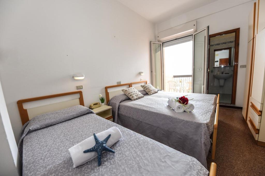 Postel nebo postele na pokoji v ubytování Hotel Caesar
