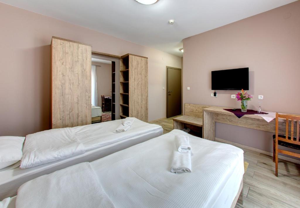 Postel nebo postele na pokoji v ubytování Motel MontaNaro