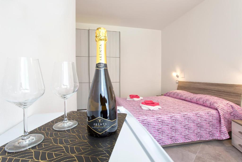 Postel nebo postele na pokoji v ubytování Nonna Adelina Apartments & rooms