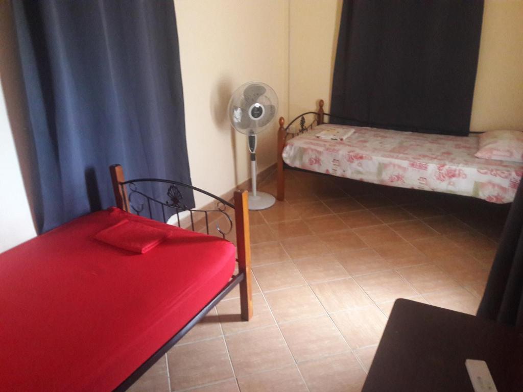 Postel nebo postele na pokoji v ubytování Le Tropical Chez Jeannette