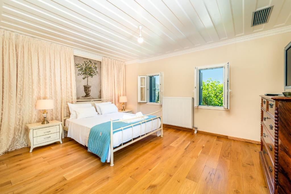 Postel nebo postele na pokoji v ubytování Siora Tanto Rustic Villa