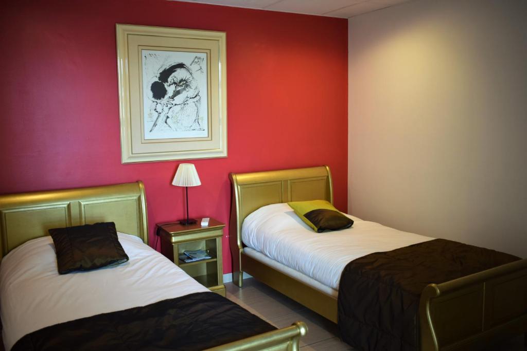 Postel nebo postele na pokoji v ubytování Logis Hôtel La Fauceille