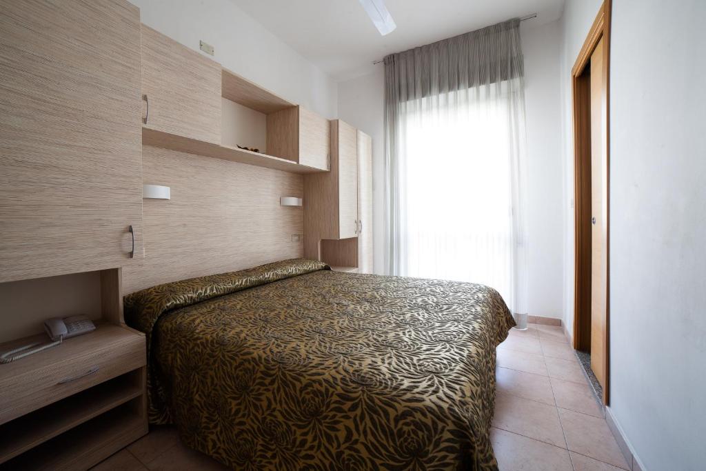 Postel nebo postele na pokoji v ubytování Hotel Plaza