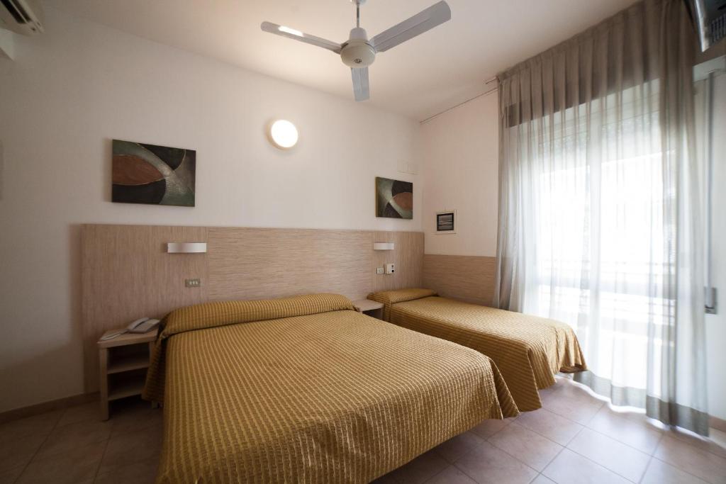 Postel nebo postele na pokoji v ubytování Hotel Plaza