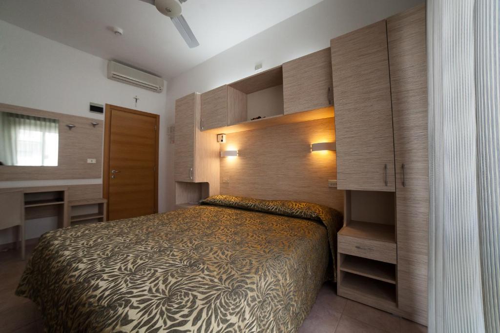 Postel nebo postele na pokoji v ubytování Hotel Plaza