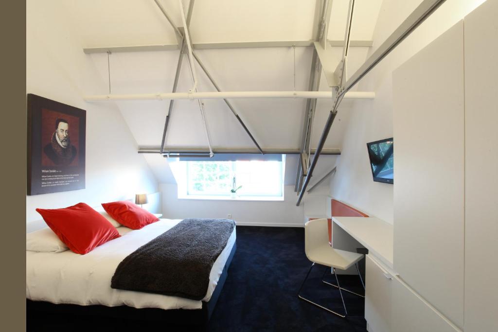 Postel nebo postele na pokoji v ubytování Hotel The Lodge Vilvoorde