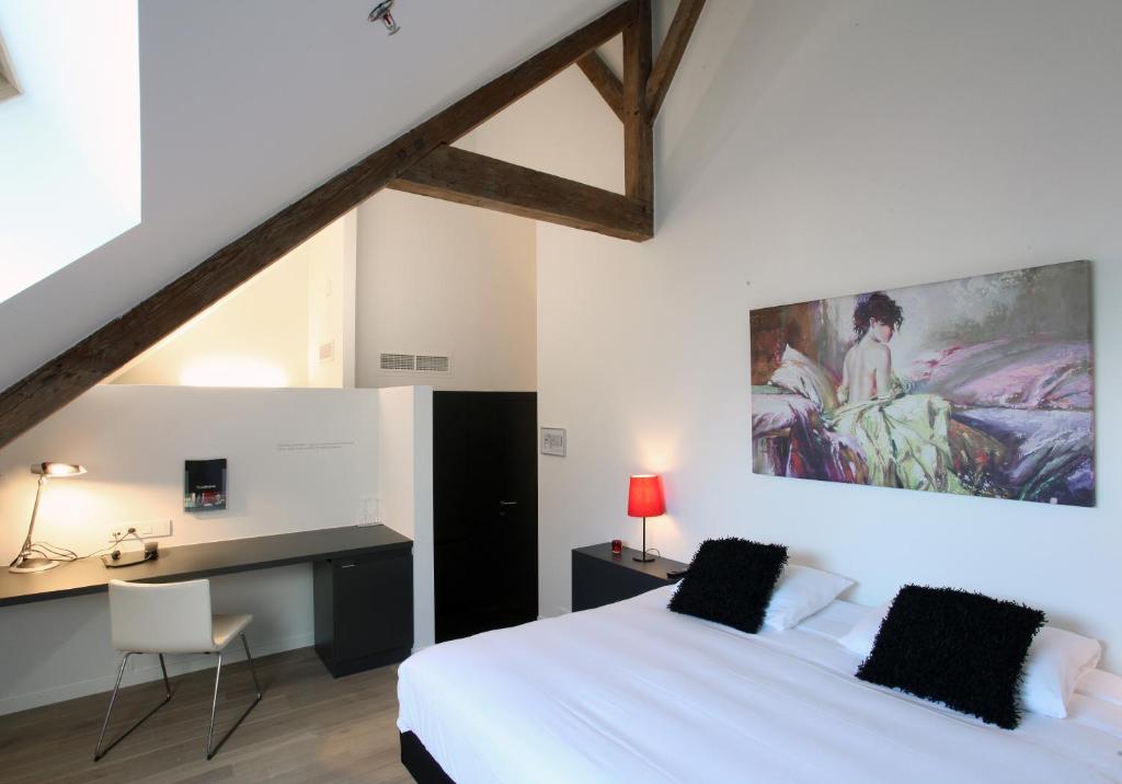 Postel nebo postele na pokoji v ubytování Hotel The Lodge Vilvoorde