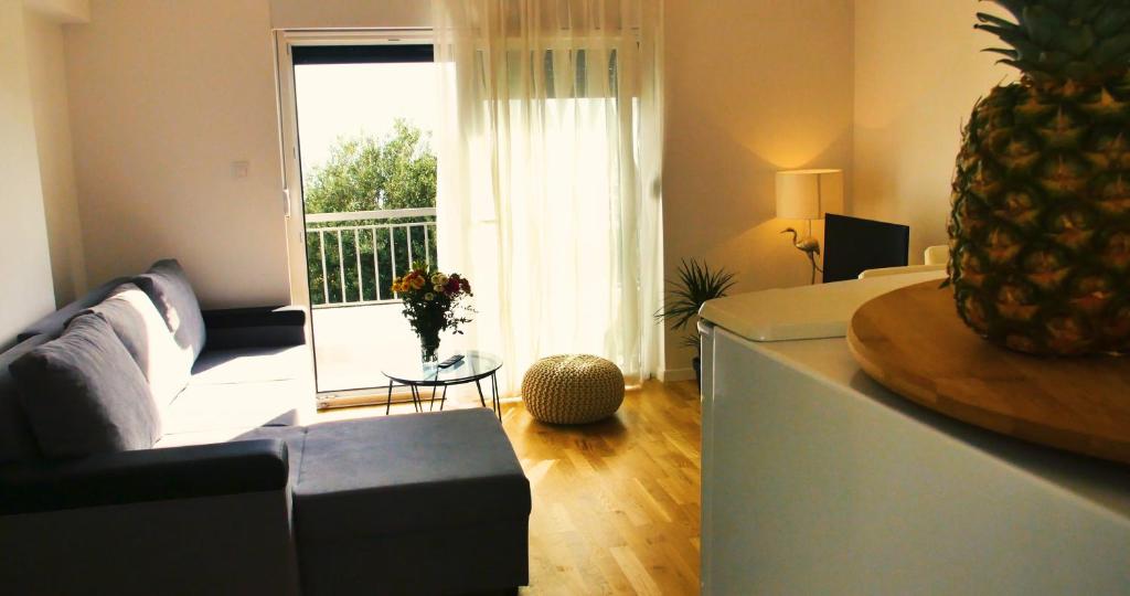 Televízia a/alebo spoločenská miestnosť v ubytovaní Apartments Beautiful View