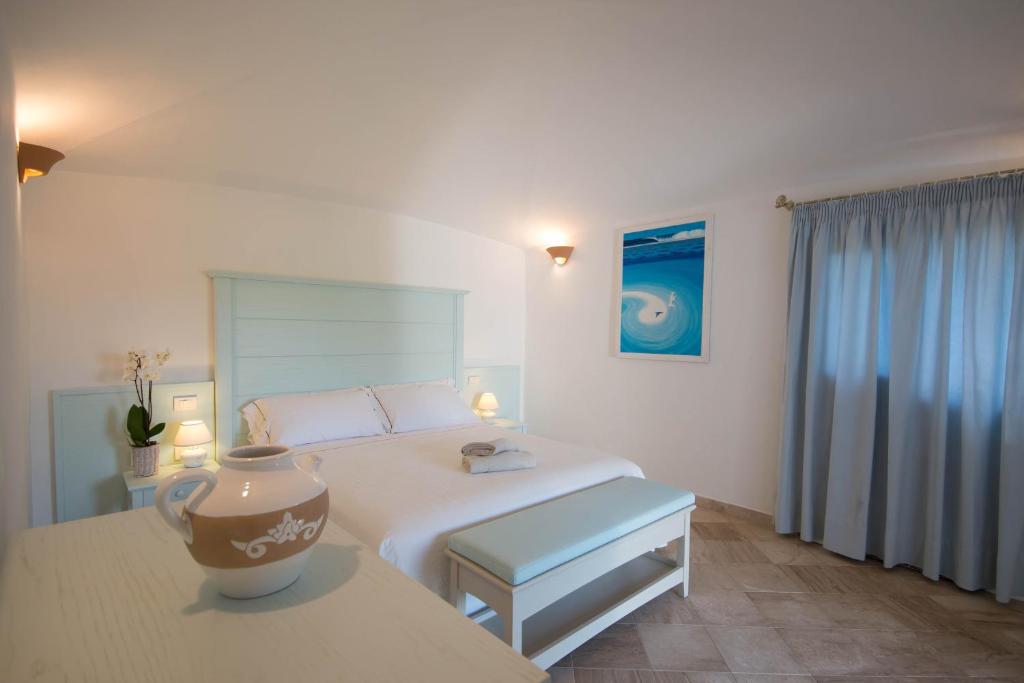 Postel nebo postele na pokoji v ubytování Hotel Nibaru