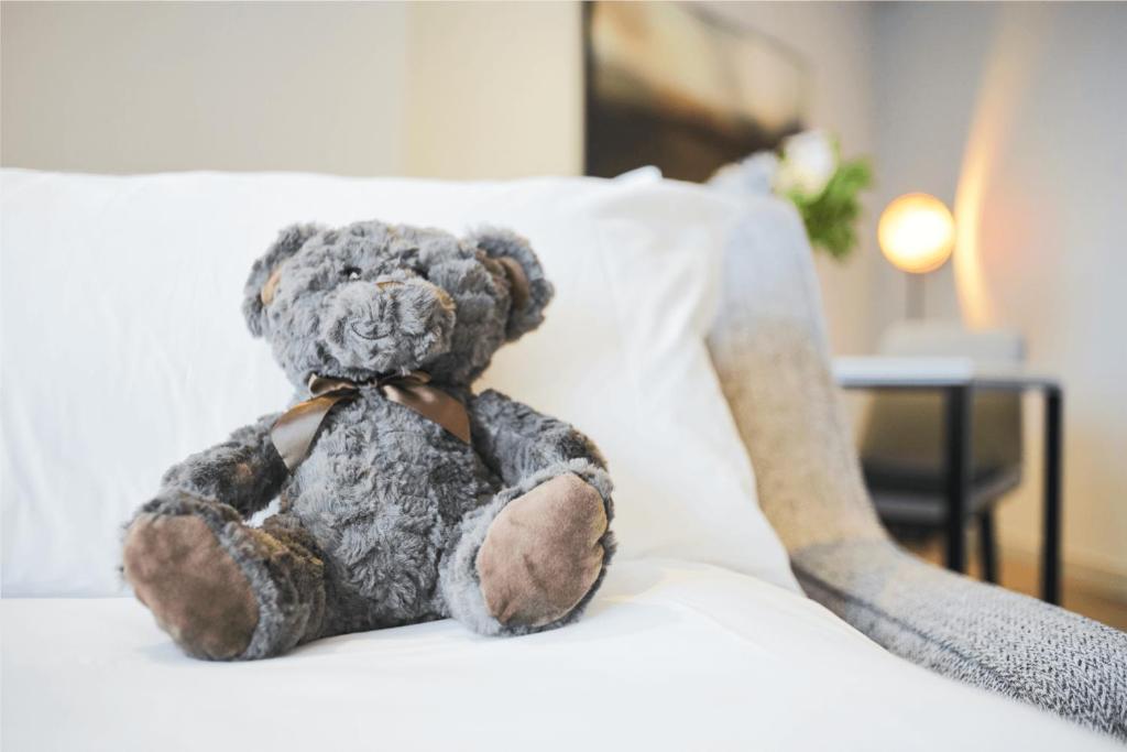 Postel nebo postele na pokoji v ubytování CitySuites Aparthotel