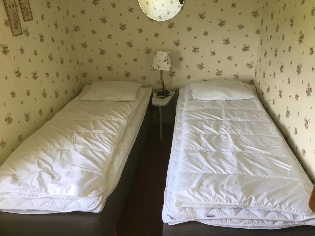 Postel nebo postele na pokoji v ubytování Tubbared.