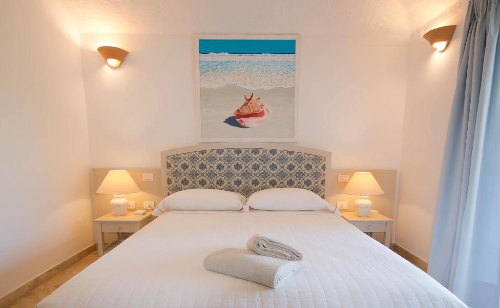 Postel nebo postele na pokoji v ubytování Hotel Nibaru