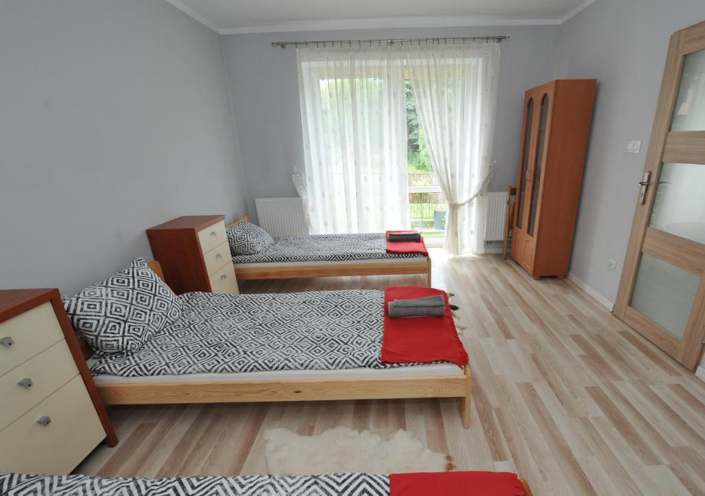 Posteľ alebo postele v izbe v ubytovaní Zakątek Alpaka