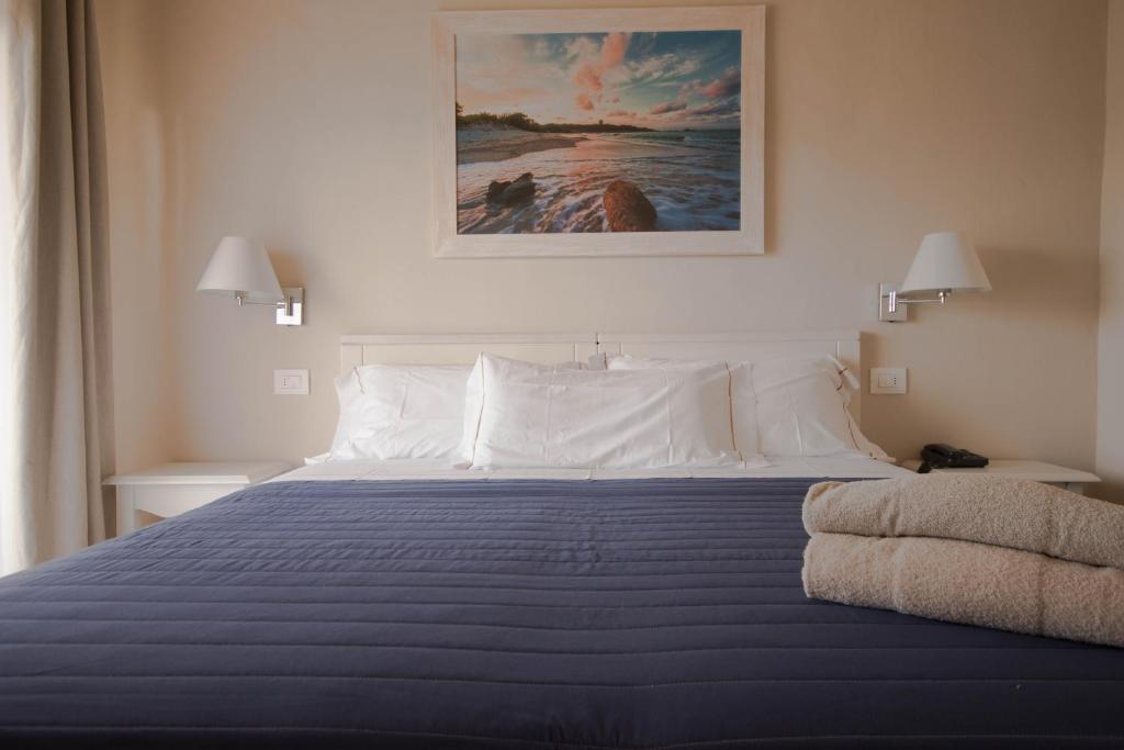 Postel nebo postele na pokoji v ubytování Hotel Nibaru