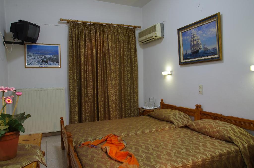 Postel nebo postele na pokoji v ubytování Effie Hotel