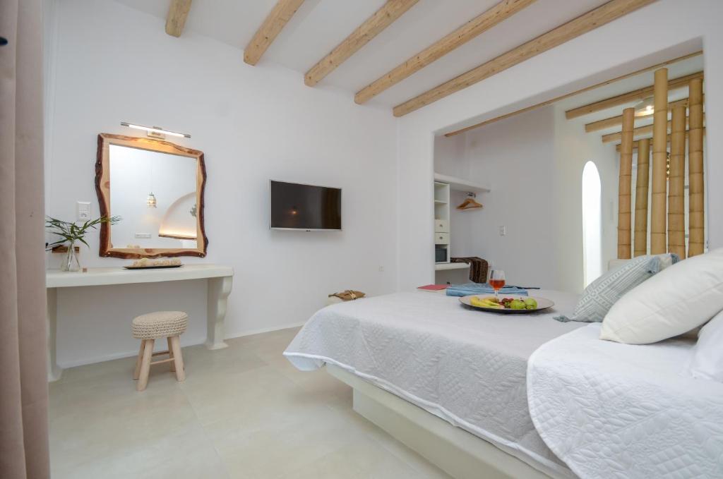 Posteľ alebo postele v izbe v ubytovaní Naxos Nature Suites