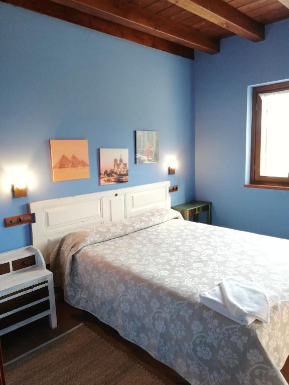 Postel nebo postele na pokoji v ubytování EcoHotel Rural Angiz