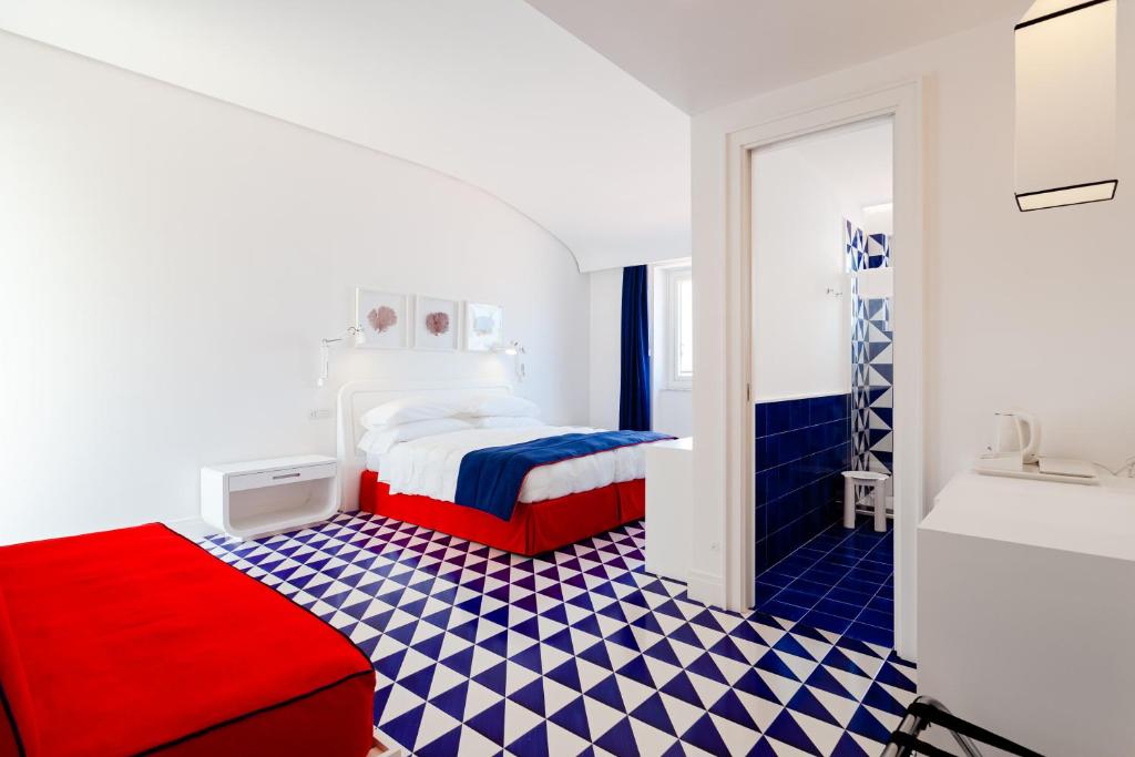 Postel nebo postele na pokoji v ubytování Maison Blu - Intimate GuestHouse