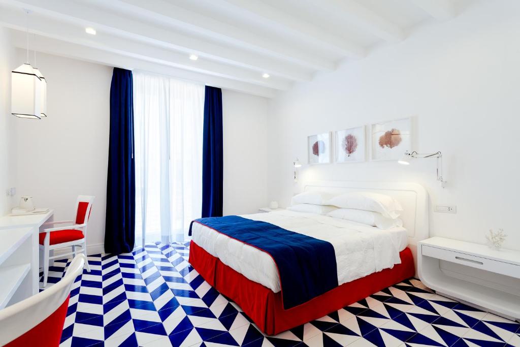 En eller flere senger på et rom på Maison Blu - Intimate GuestHouse