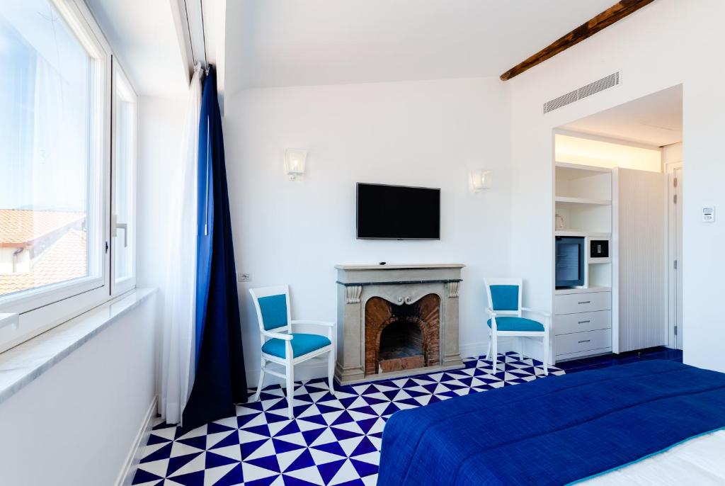 TV a/nebo společenská místnost v ubytování Maison Blu - Intimate GuestHouse