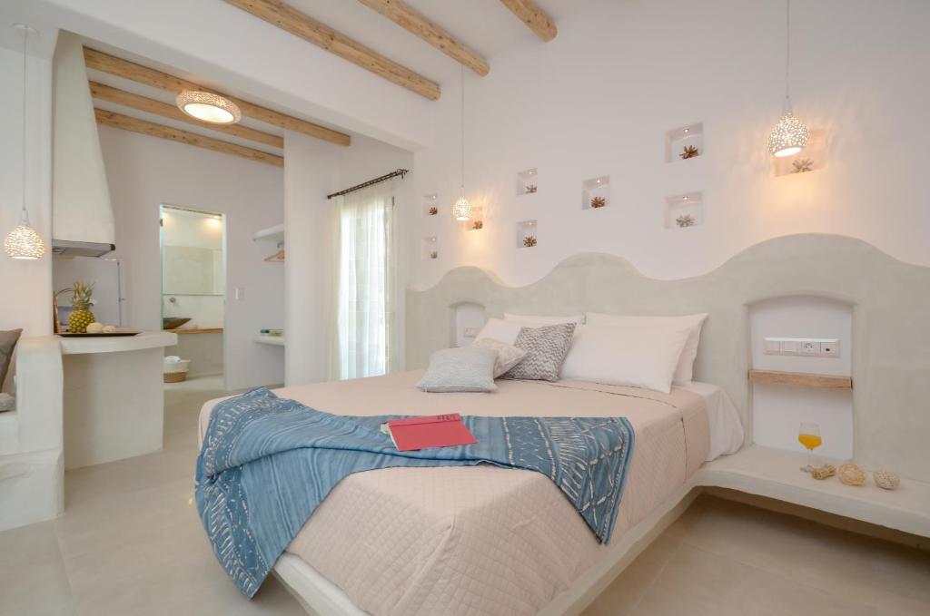 Posteľ alebo postele v izbe v ubytovaní Naxos Nature Suites