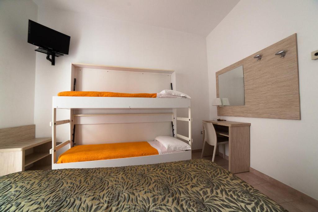 Postel nebo postele na pokoji v ubytování Hotel Plaza