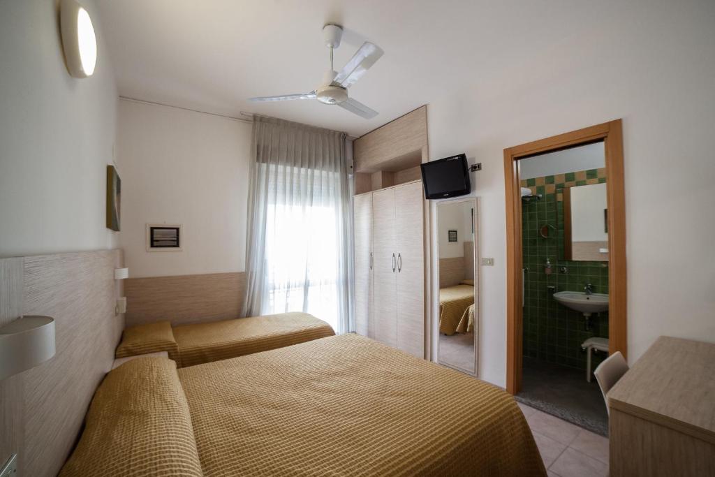Postel nebo postele na pokoji v ubytování Hotel Plaza