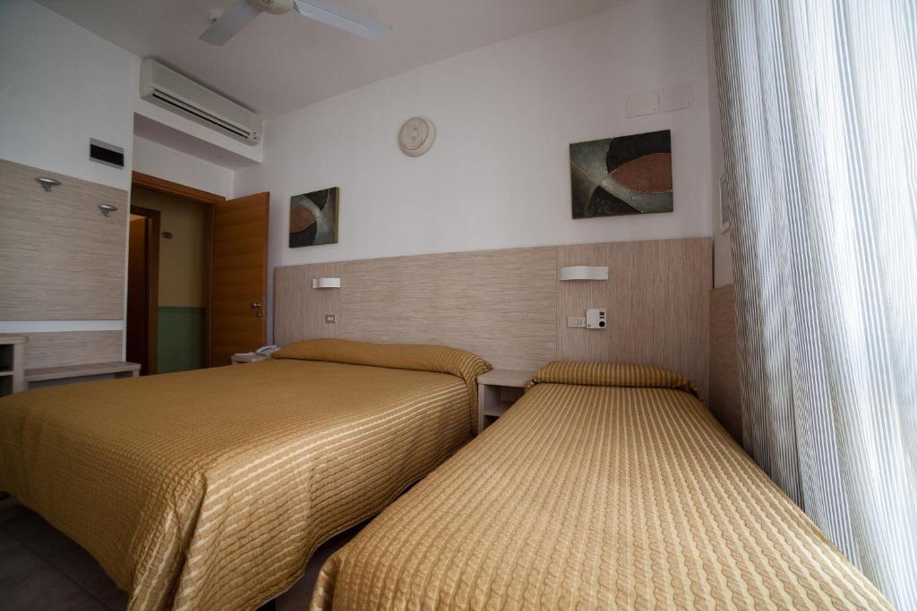 Postel nebo postele na pokoji v ubytování Hotel Plaza