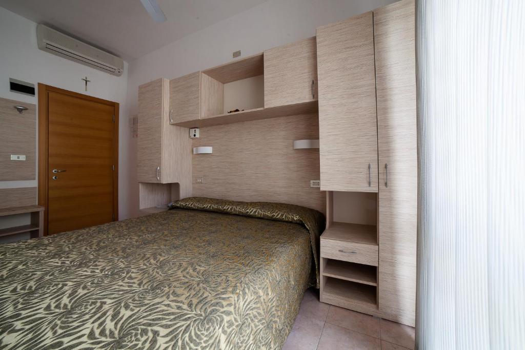 Postel nebo postele na pokoji v ubytování Hotel Plaza