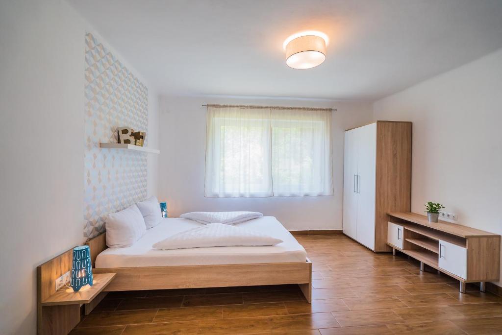 Posteľ alebo postele v izbe v ubytovaní Villa Magdolna