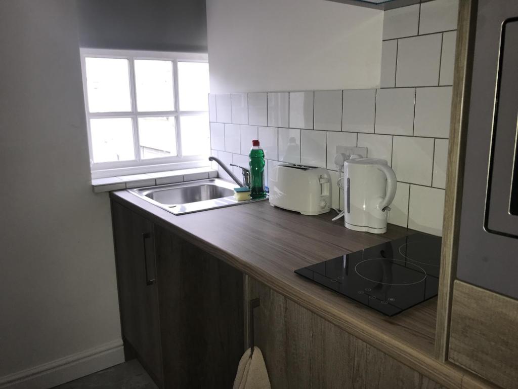 Kuchyň nebo kuchyňský kout v ubytování Lancaster Place Apartments