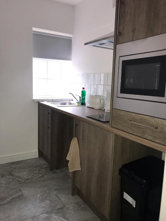 Kuchyň nebo kuchyňský kout v ubytování Lancaster Place Apartments