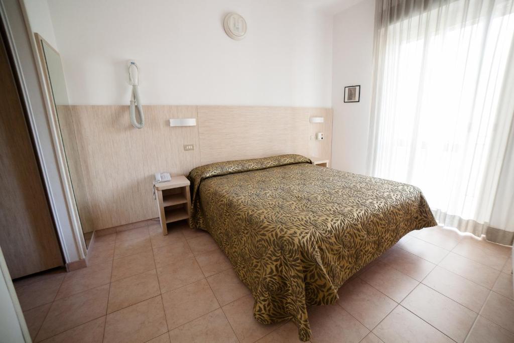 Postel nebo postele na pokoji v ubytování Hotel Plaza