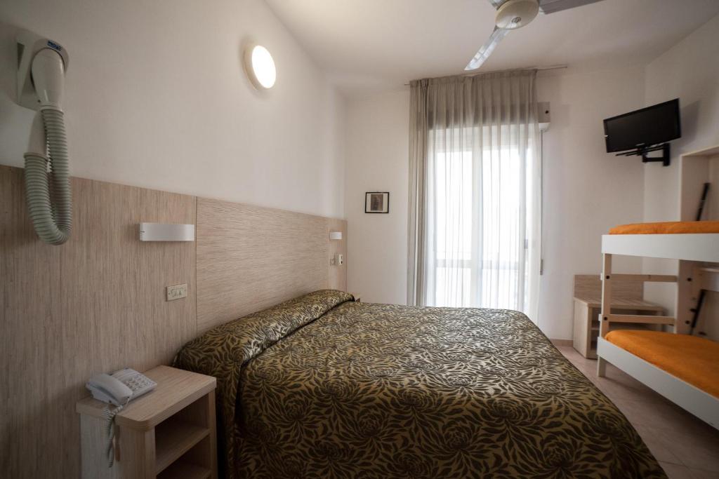 Postel nebo postele na pokoji v ubytování Hotel Plaza