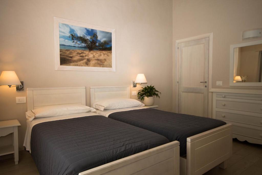 Postel nebo postele na pokoji v ubytování Hotel Nibaru