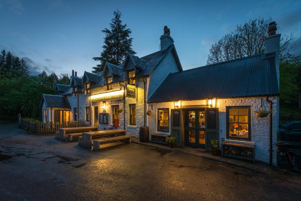 a large building with benches in front of it at The Kilchrenan Inn in Oban