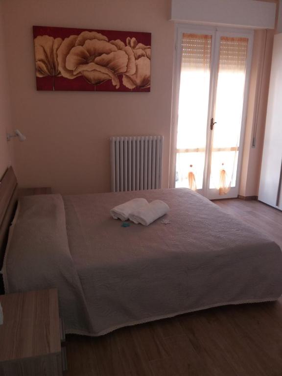 Postel nebo postele na pokoji v ubytování B&B Un posto al Sole
