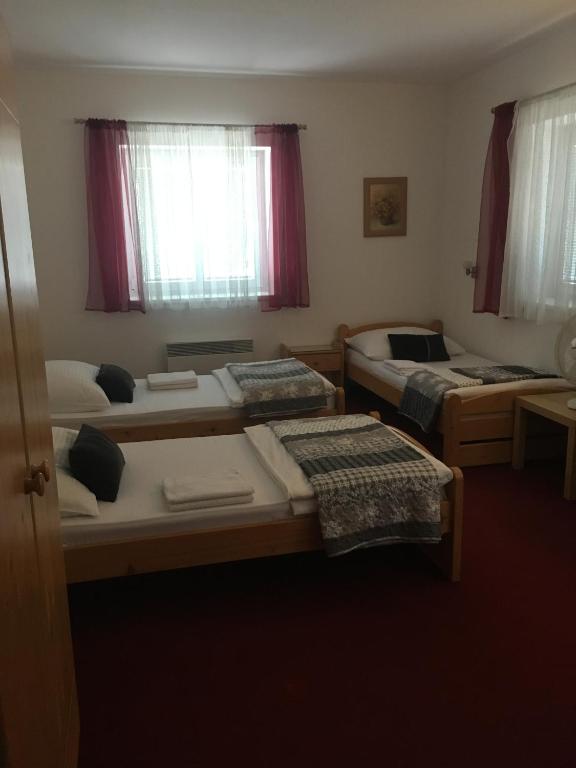 Postel nebo postele na pokoji v ubytování Pension Miltom