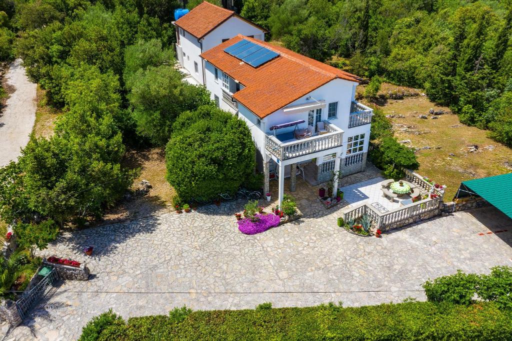 an aerial view of a large house with an orange roof at Studios Kranjcec in Preko