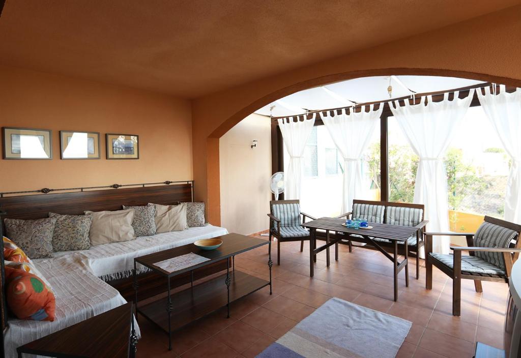 a living room with a couch and a table at Villa Marina Apartment AB2 in Águilas