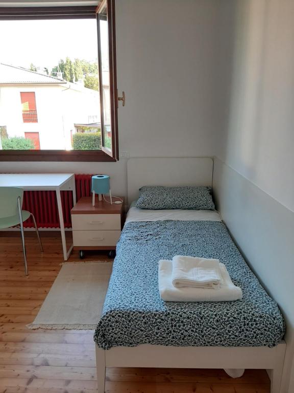 Postel nebo postele na pokoji v ubytování Alloggio il Giglio
