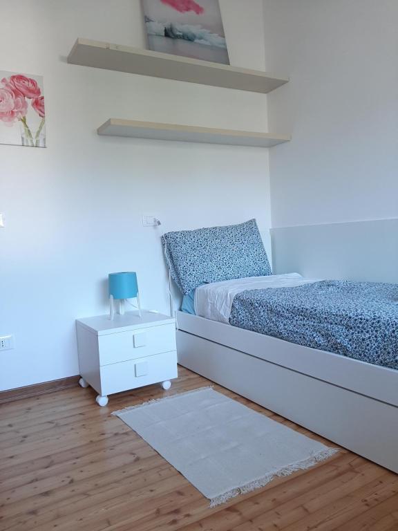 Postel nebo postele na pokoji v ubytování Alloggio il Giglio