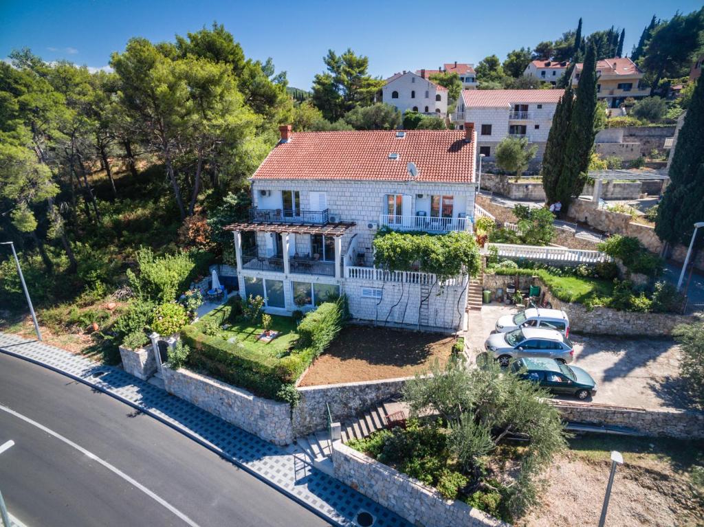 an aerial view of a house with a car at Apartment Siesta in Cavtat